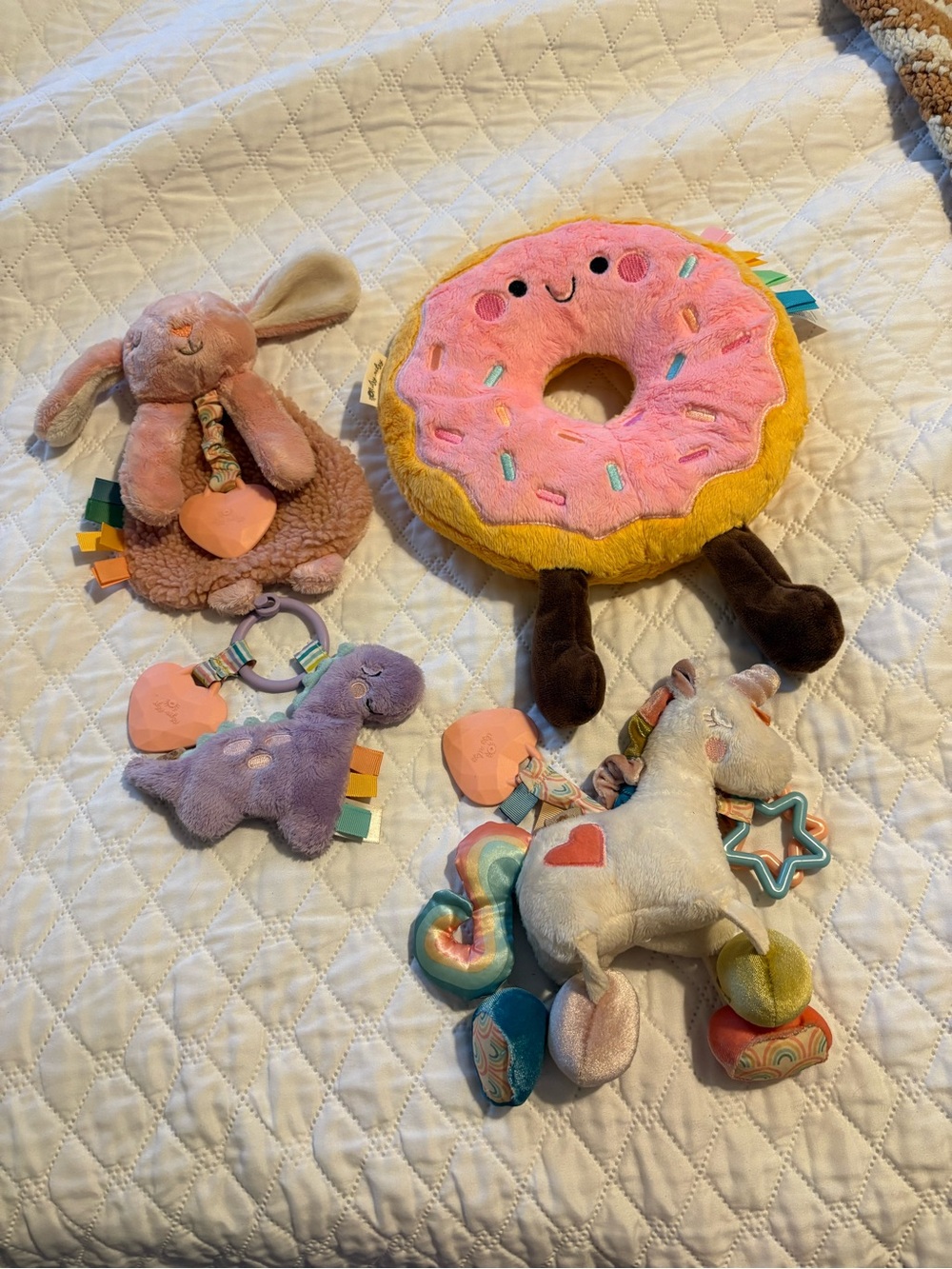 Itzy Ritzy Pink & Yellow Donut Plush Activity Toy with Brown Legs and 3 teethers